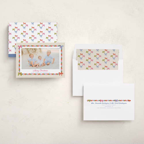 This is a buttercream holiday photo cards with standard by Erika Firm called paperchain border printing on recycled smooth signature in standard