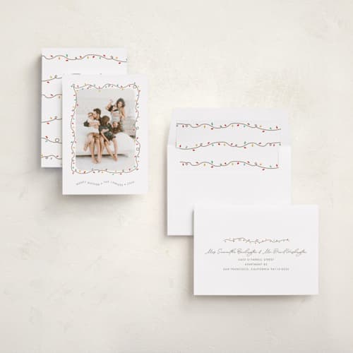This is a frosting holiday photo cards with standard by Holly Whitcomb called crazy lights printing on recycled smooth signature in standard