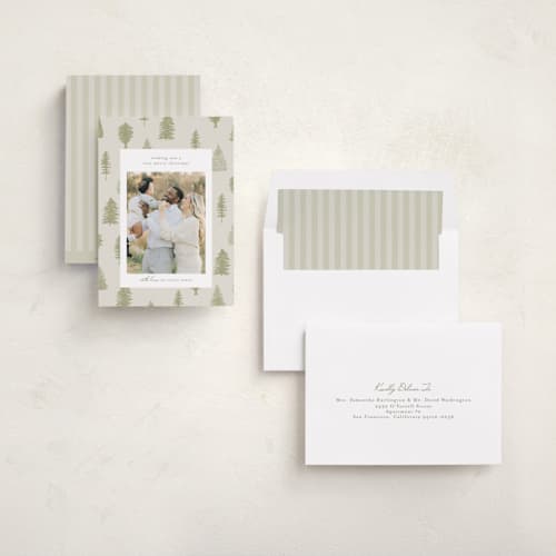 This is a greenery holiday photo cards with standard by Heather Cairl called all evergreen printing on recycled smooth signature in standard