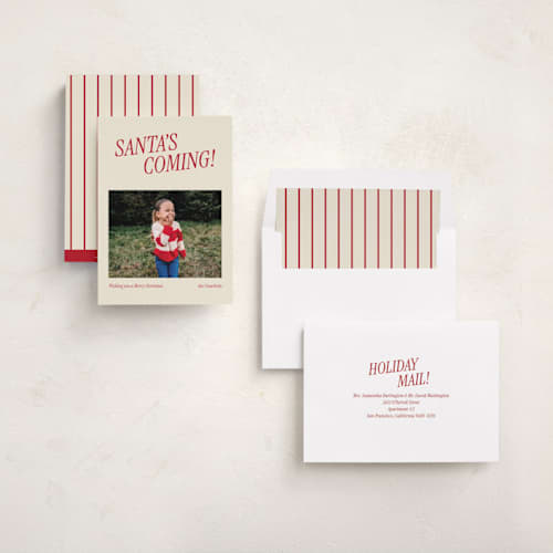 This is a candy cane holiday photo cards with standard by Angela Garrick called santa's coming printing on recycled smooth signature in standard