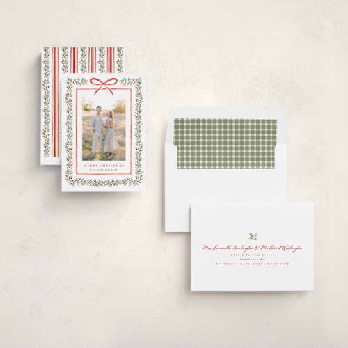 This is a holly berry holiday photo cards with standard by Wildfield Paper Co called eucalyptus + holly printing on recycled smooth signature in standard