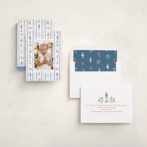 This is a blue spruce holiday photo cards with standard by Sarah Knight called nutcracker pattern printing on recycled smooth signature in standard