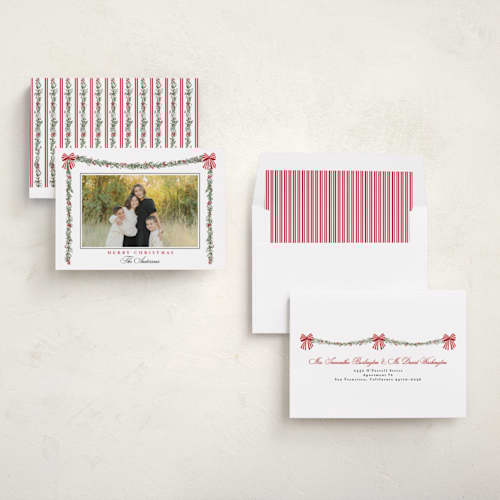 This is a candy cane holiday photo cards with standard by Susan Moyal called holly & bows printing on recycled smooth signature in standard