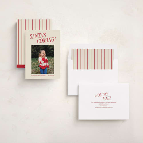 This is a candy cane holiday photo cards with standard by Angela Garrick called santa's coming printing on recycled smooth signature in standard