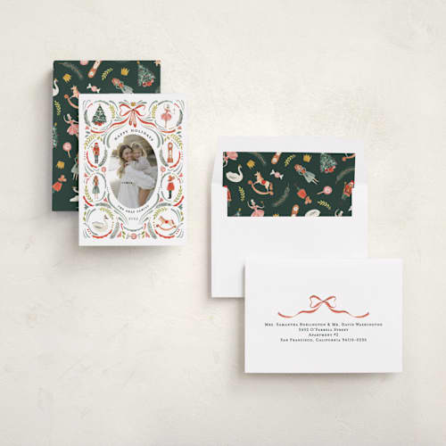 This is a holly leaf holiday photo cards with standard by Sarah Knight called nutcracker dance printing on recycled smooth signature in standard