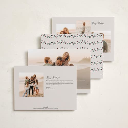 This is a vanilla holiday photo cards with standard by Sarah Rosenthal called festive town printing on recycled smooth signature in standard