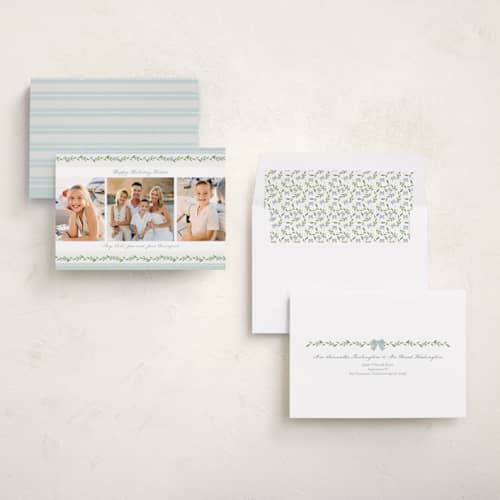 This is a coastal holiday photo cards with standard by Susan Moyal called holiday bows printing on recycled smooth signature in standard