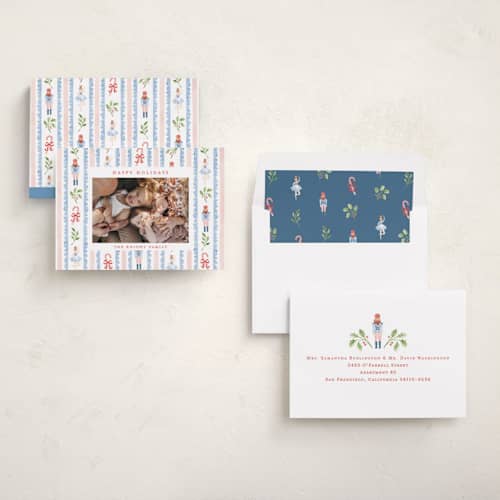 This is a blue spruce holiday photo cards with standard by Sarah Knight called nutcracker pattern printing on recycled smooth signature in standard