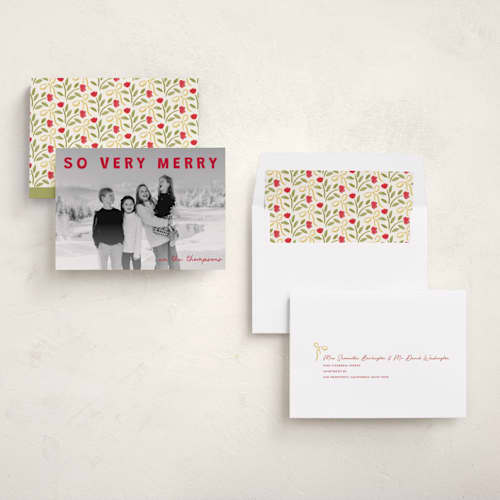 This is a holly holiday photo cards with standard by Jenny Millington called merry greeting printing on recycled smooth signature in standard