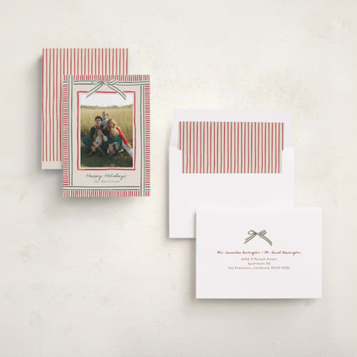 This is a ruby holiday photo cards with standard by Chris Griffith called holiday wrap printing on recycled smooth signature in standard