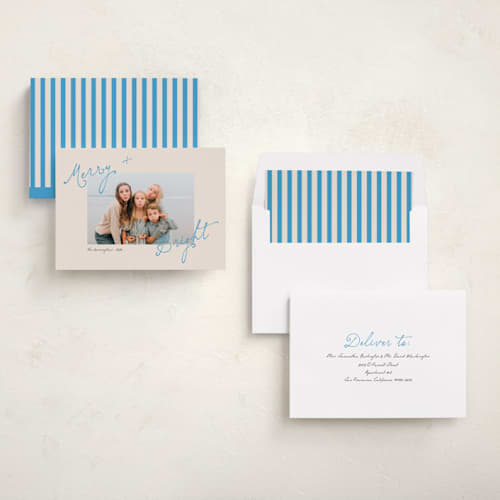 This is a electric blue holiday photo cards with standard by Morgan Kendall called topsy turvy printing on recycled smooth signature in standard