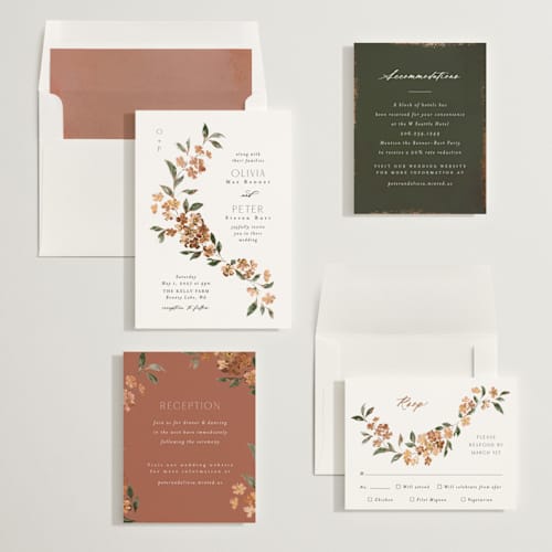 This is a terracotta foil stamped wedding invitations with foil pressed by Itsy Belle Studio called sweeping vine printing on signature in standard