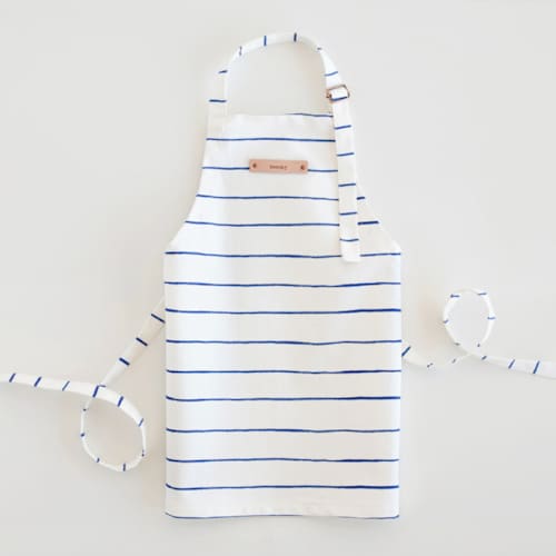This is a snorkel blue kids aprons by Melissa Selmin called breton stripe in standard