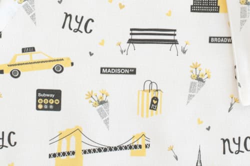 This is a taxi yellow kids aprons by Kristie Kern called new york in standard