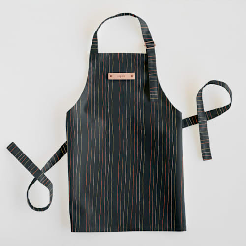 This is a night kids aprons by Multiple Artists called strands of tradition 2 in standard