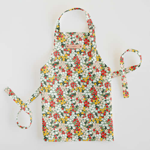 This is a scarlet kids aprons by Kelsey Carlson called field of florals in standard