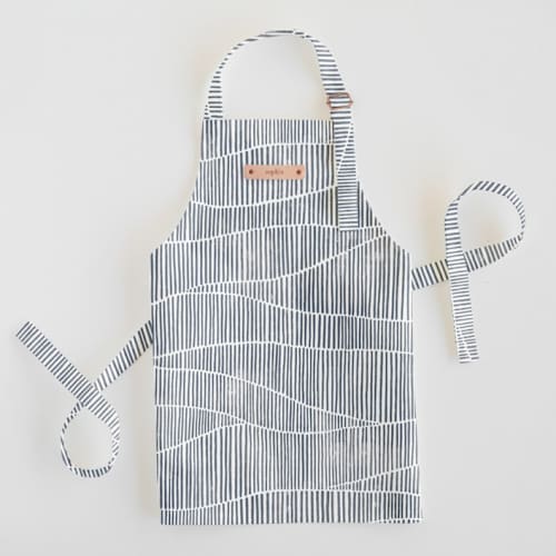 This is a storm kids aprons by Michelle Taylor called wavy in standard
