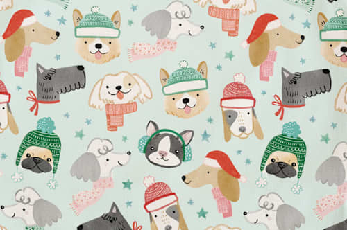 This is a mint kids aprons by Monika Torun called christmas puppies in standard