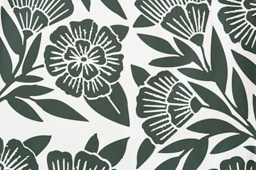 This is a dark teal kids aprons by Katharine Watson called block print floral in standard