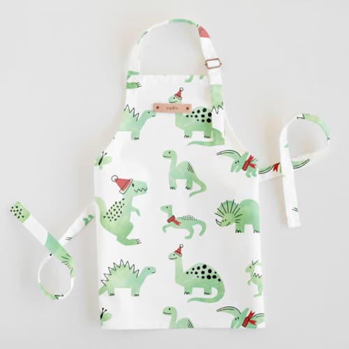 This is a mint kids aprons by Jessie Steury called darling dinos in standard
