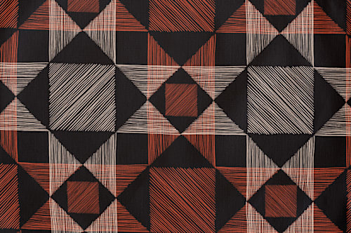 This is a rust kids aprons by Alethea and Ruth called sketched quilt in standard