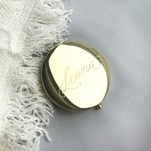 This is a multicolorassorted-colors all gifts by Charlotte Noordzij called compact mirror engraved in standard