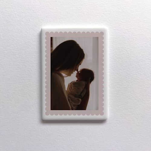 This is a white all gifts by Holly Whitcomb called custom ceramic photo magnet: scalloped in standard