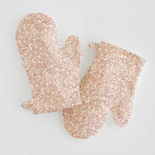 This is a tan kids aprons by Michelle Fifis called animal dots in standard
