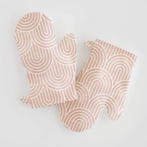 This is a pink kids aprons by Hooray Creative called deco arches in standard