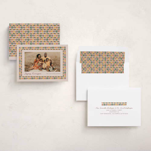 This is a cream kwanzaa cards with standard by Carmia C. called kente border printing on recycled smooth signature in standard