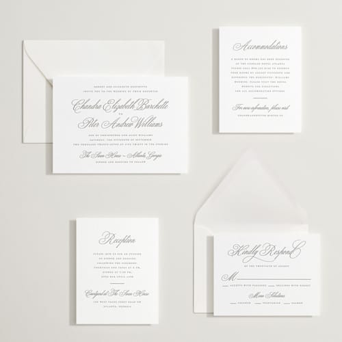 This is a graphite letterpress wedding invitations with letterpress by Wildfield Paper Co called calligraphie printing on white cotton in standard