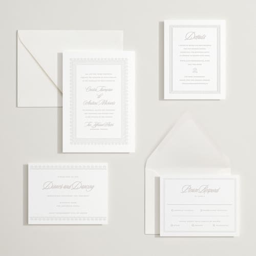 This is a dove grey letterpress wedding invitations with letterpress by Vera Lim called shell border printing on white cotton in standard
