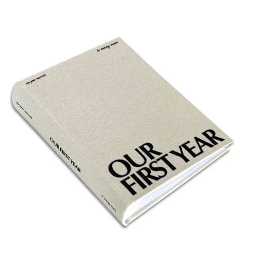 This is a beige wedding gifts by The Ceremony Club called our first year photo album in standard