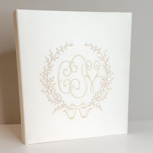 This is a white wedding gifts by Annie May called wedding memory book — ivory silk w/accent in standard