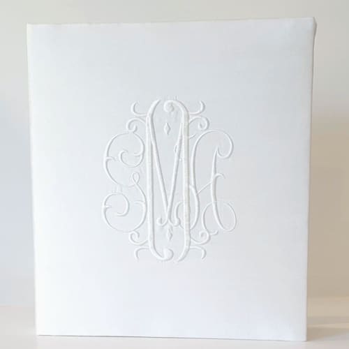 This is a white wedding gifts by Annie May called wedding memory book — white silk in standard