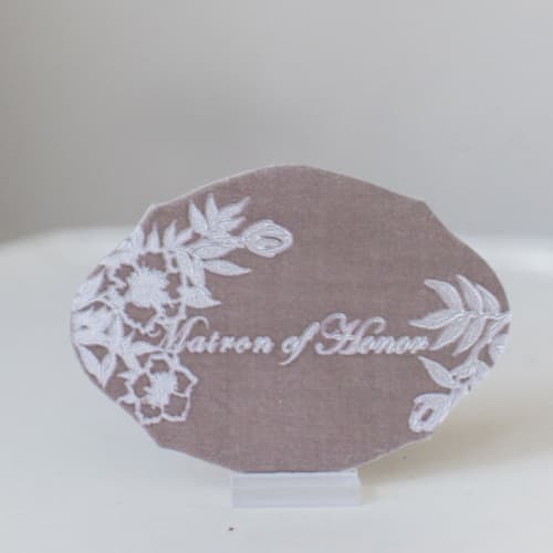 This is a beige bridesmaid gifts by Velvet Raptor called matron of honor oval card in standard