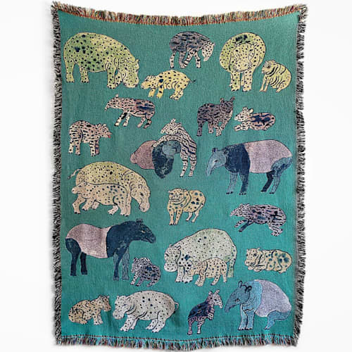 This is a multicolorassorted-colors throw blankets by Olivia Wendel called hippos and tapirs blanket in standard