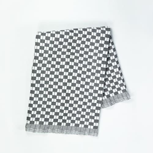 This is a black throw blankets by Archive New York called suzani black and white quilted cotton throw blanket in standard