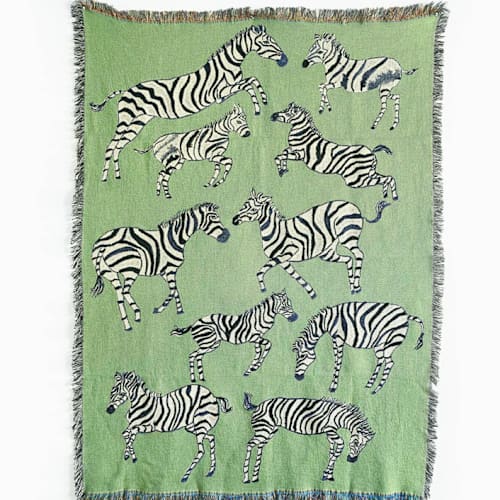 This is a green throw blankets by Olivia Wendel called green zebras blanket in standard