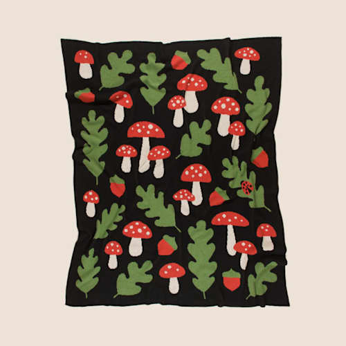This is a black throw blankets by Superstitchous called forest throw blanket in standard