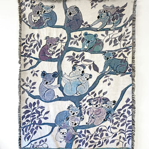 This is a multicolorassorted-colors throw blankets by Olivia Wendel called koalas blanket in standard