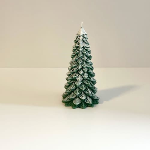 This is a multicolor candles and candle holders by Over By The Moon called medium white and green christmas tree candle in standard