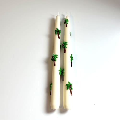 This is a multicolor candles and candle holders by Over By The Moon called white palm tree taper set in standard