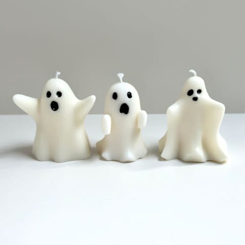 This is a white candles and candle holders by Over By The Moon called white ghost candle set in standard