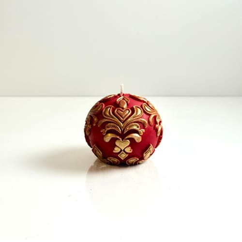 This is a multicolor candles and candle holders by Over By The Moon called red and gold christmas ornament handle in standard