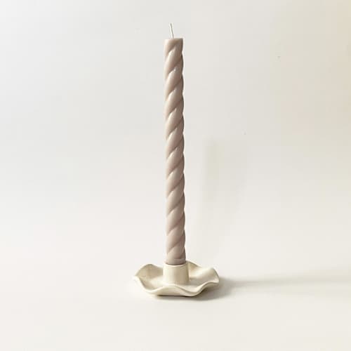 This is a white candles and candle holders by Joanne Lee called handmade ceramic ruffle cottagecore taper candle holder in standard