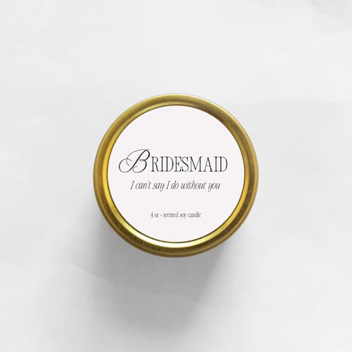 This is a gold candles and candle holders by Aria Bella Candles called bridesmaid i can't say i do without you soy candle | gold travel tin in standard