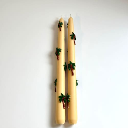 This is a multicolor candles and candle holders by Over By The Moon called tan palm taper set in standard