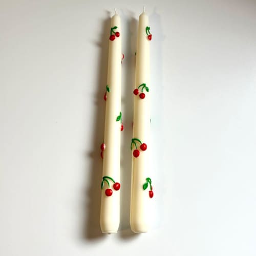 This is a multicolor candles and candle holders by Over By The Moon called white cherry taper set in standard