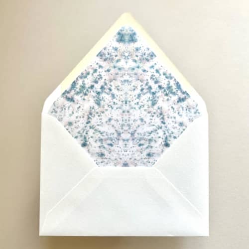 This is a blue wedding envelopes by Renée Stramel called a7 envelope liners speckled symmetry in teal confetti euro flap envelopes | pack of 10 in standard